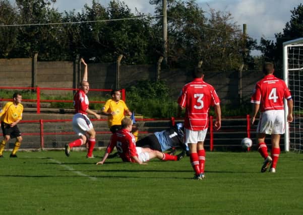 Workington appeal in vain for offside as Lee Moore equalises for Leamington. Picture: Sally Ellis