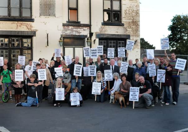 MHLC-08-10-13 Dog Inn Oct35

Campaigners against plans to turn the former pub into a nursery and house are  Demonstration against the change .