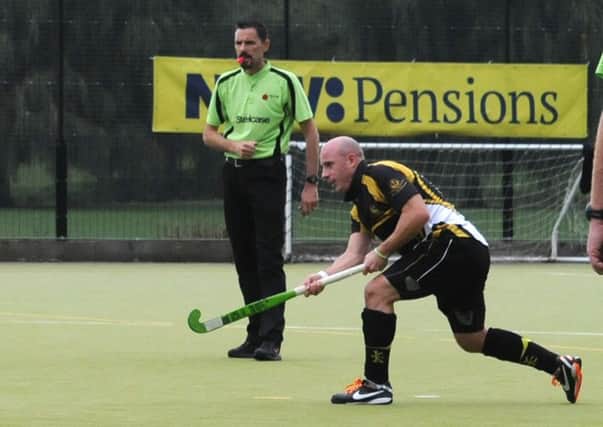 Dave Harris converts one of his two penalty strokes on his way to a hat-trick against Olton & West Warwickshire. 
MHLC-12-10-13 Khalsa hockey Oct46