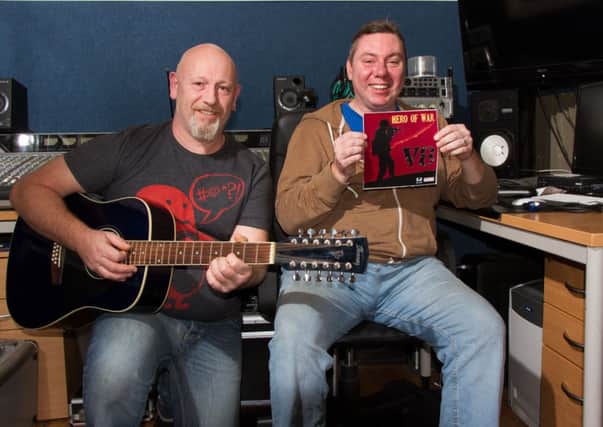Producer Matt Waddell of 14 records and V8 frontman Dave Cowen show off the Oxjam Leamington charity single Hero of War. Photo by Trevor Davies.