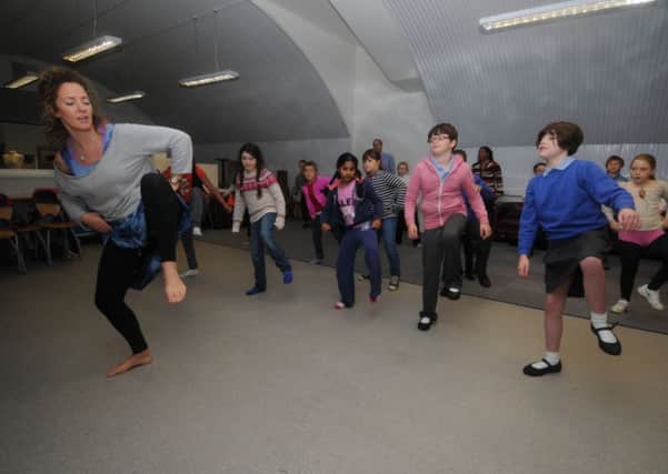 Children from Clapham Terrace Primary School were attending an event for Black History Month at Platform 4 art gallery in Leamington on Tuesday.
Children learn some moves with Saskia Bakayoko from 'West African Drum and Dance'.
MHLC-21-10-13 Black History Oct59
