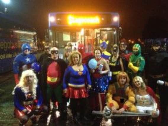Staff at Stagecoach in Leamington show off their superheroes costumes.