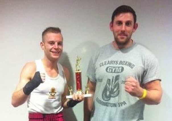 Michael Jephcott with his coach Jamie Bannister after winning the ABA novices pre-quarter-final.