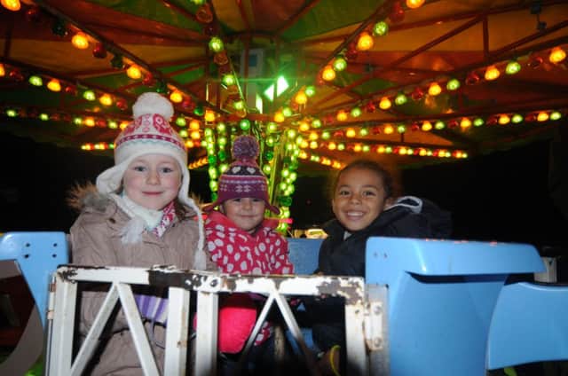 Children enjoying rides at the Festival of Lights at the Sydni Centre.