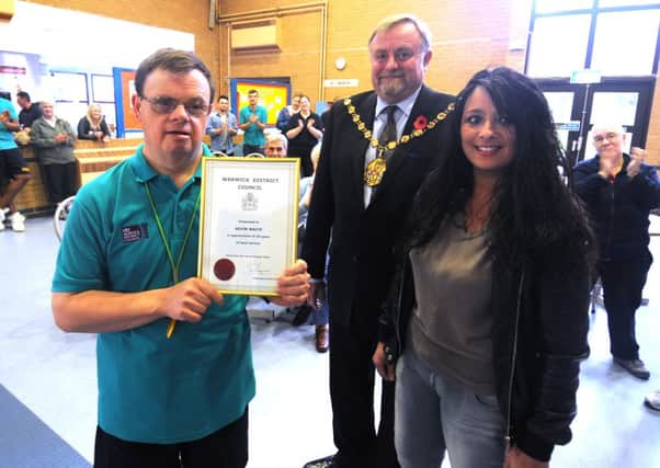 Kevin Waite receiving his long service certificate from Warwick District Council Chairman Councillor Richard Davies at Newbold Comyn Leisure Centre, Leamington, on Friday. Also pictured is Amanda Poon-Jones (Centre Manager).
MHLC-08-11-13 Long service Nov31