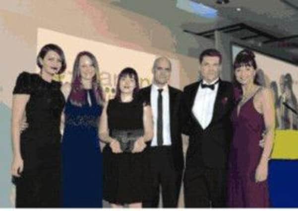 L to R : Emma Brown (Head of Learning and Development at Waterstones) , Tess Robinson (Director, LearningAge Solutions), Vikki Boekbinder (Waterstones), Rob Hubbard (Managing Director, LearningAge Solutions), Ben Betts, Angela Lamont (host). LearningAge Solutions and Waterstones receiving the award for Best eLearning Project  Private Sector.