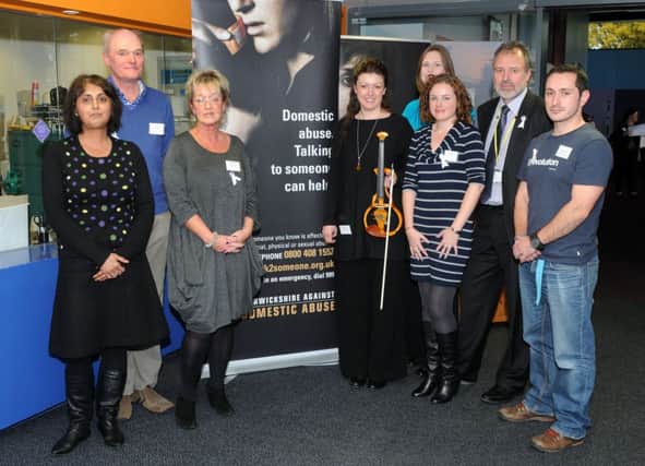 Representatives from various agencies in Warwickshire get together to raise awareness of domestic abuse and violence against women.
