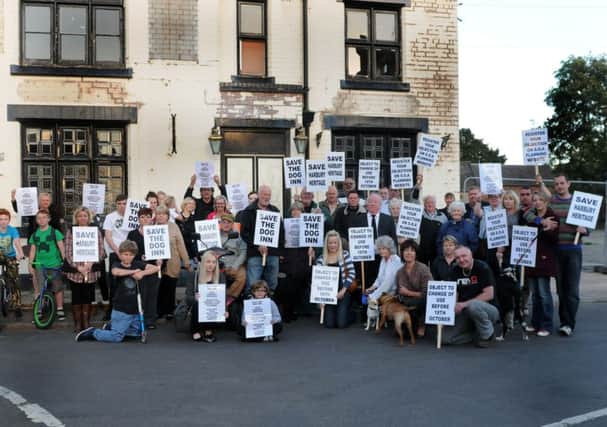 Campaigners against plans to turn the former pub into a nursery pictured earlier this year.