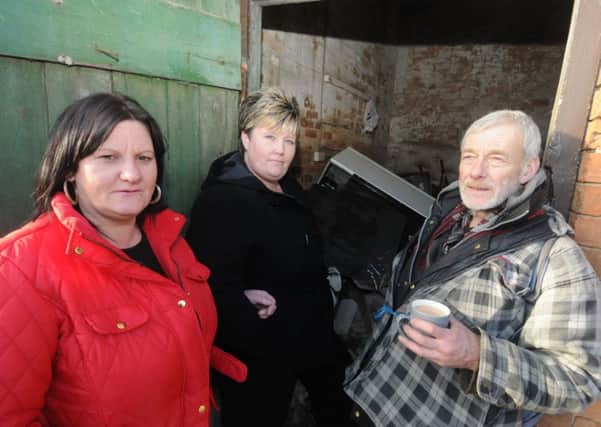 Stacy Green and Jayne Blackburn with homeless man Bob outside the stable at the  Foresters Arms in Warwick.