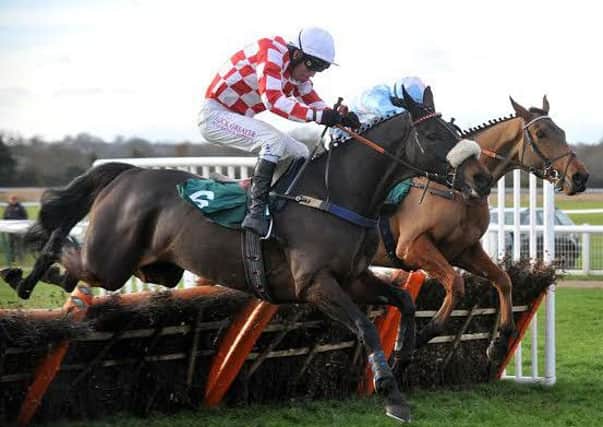 Richard Johnson and Champagne West on their way to victory in the maiden hurdle at Warwick last Sunday. Picture: Les Hurley