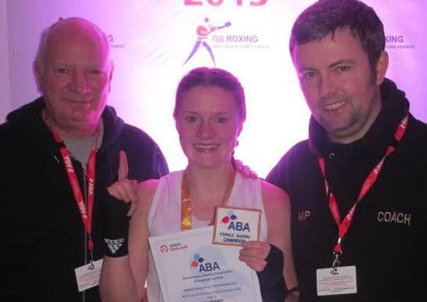 Molly Perkins, centre, with father and coach Rick Perkins and head coach Mat Pickering. Picture submitted