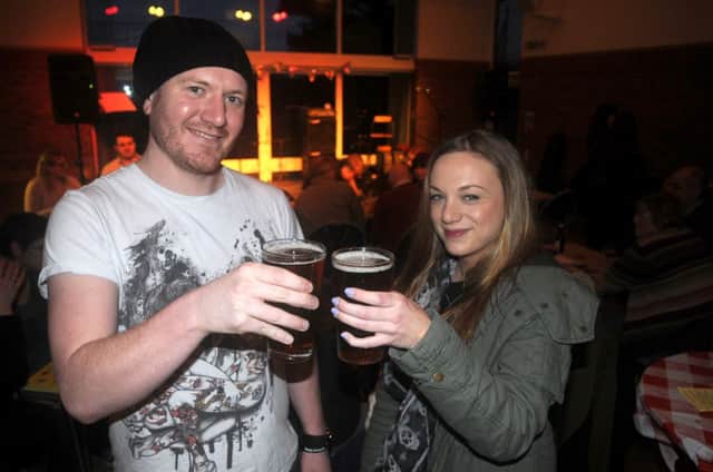 Drinkers enjoy sampling beers at last year's 12th Night Beer Festival in Eathorpe.