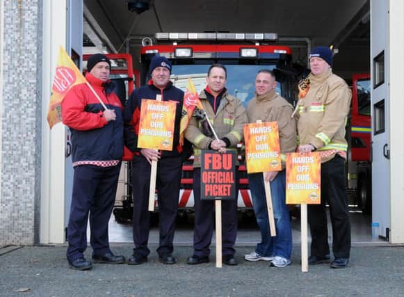 Firefghters on strike out side the  Leamington fire station in November.