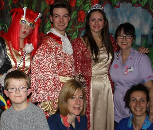 Panto actors from Starlight with a patient and staff at Warwick Hospital's children's ward.