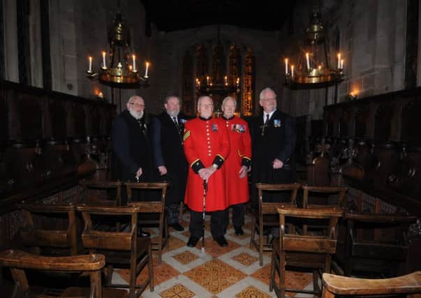 Brother John Maughan (on right) with his two Chelsea Pensioner friends John Humphreys 91 and Bill Gorrie 74 look around the Chantry Chapel of St James The Greater, within the Lord Leycester Hospital in Warwick, before the service by candlelight held on Monday night. Also pictured are Brother Bill Bradford and Brother Frank Beal.     
MHLC-16-12-13 leycester dec47