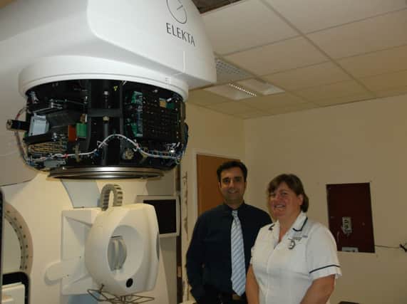 Dr Spyros Manolopoulos and radiation therapy manager Linda Farthing with the new linear accerelator radiotherapy machine at the University Hospital in Coventry.