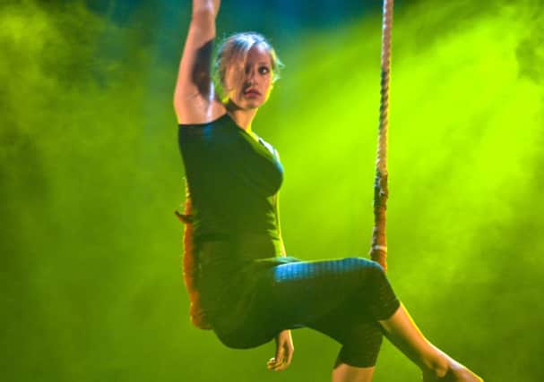 Lauren Deeth-Kelt performing trapeze for the Playbox Theatre.
