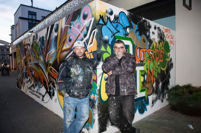 Graffiti artists Mef and Kem with their graffiti wall outside Gallery 150 in Leamington. Picture by James Callaghan.