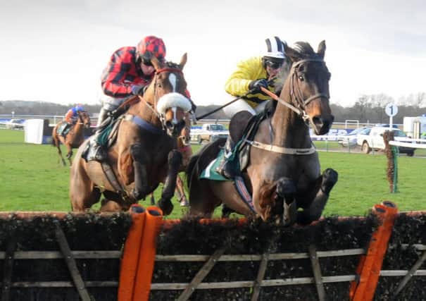 Irish trainer Willie Mullins had his first-ever winner at Warwick on Saturday when Glens Melody and jockey David Casey, right, got the better of Mischievous Milly and Leighton Aspell in the opening novices hurdle. 
MHLC-11-01-14 Warwick Races Jan14