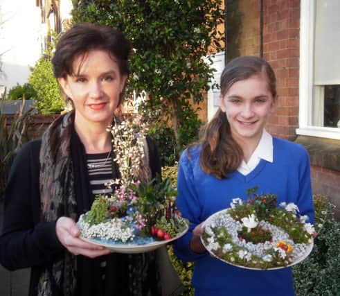 Leamington floral designer Sarah Horne gives some tips to Kingsley School pupil Madeleine Glasspool.