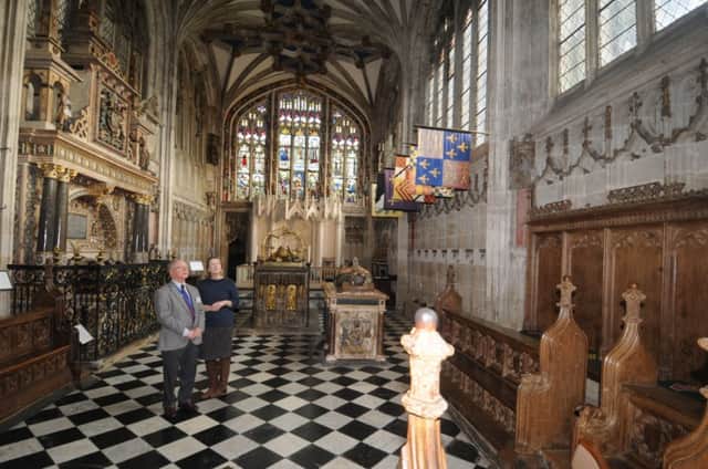 St Mary's church guide Patrick Littlejohn and parish administrator Felicity Bostock looking at the Beauchamp Chapel's south wall, which is going to be renovated.