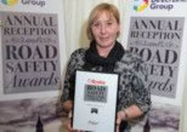 Pcso Sharron Underwood with her award
