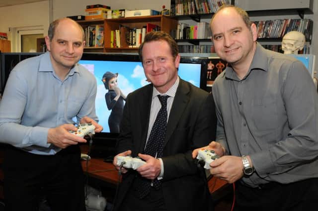 Philip and Andrew Oliver, co-founders of Blitz Games, with Warwick and Leamington MP Chris White pictured before the company closed down.