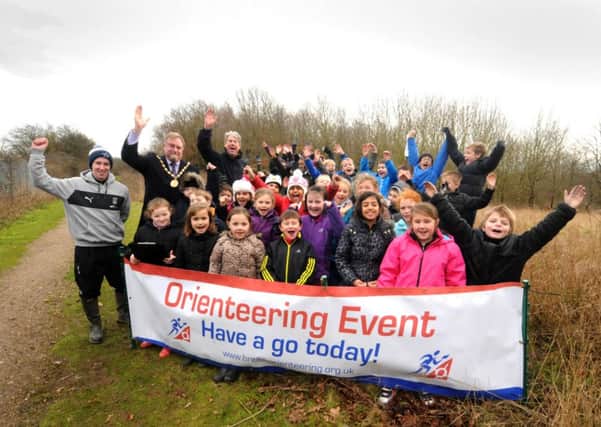 As part of the Impact project on the Forbes Estate in Warwick, funded by Warwick District Council, Newburgh Primary School were attending the Orienteering course at Jubilee Wood on Monday. The children are pictured with Chairman of Warwick District Council Cllr. Richard Davies, Oli Jones from the Sky Blues and Cllr. Stephen Cross (Portfolio Holder for Culture). MHLC 03-02-14 Orienteering Jan47