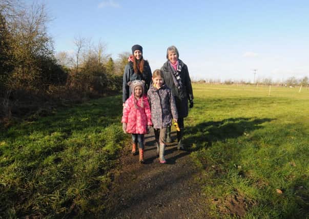 Terri Du Bois enjoys the sensory walk at thr Lilac field with her children Esme, 5, and Evie, 7, plus Janet Whitehead.