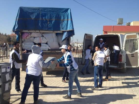 Aid work being carried out by Simon Le Tocq and his colleagues on the Syrian-Turkish border.