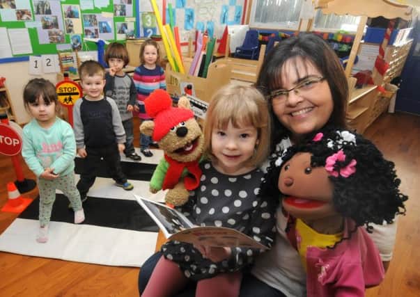 Caroline McCluskey reads a story from 'Warwick the Bear ' to Annie 3, while puppets 'Warwick the Bear ' and 'Ruby' join in the fun.
MHLC-13-02-14 safety feb27 




MHLC-13-02-14 safety feb27