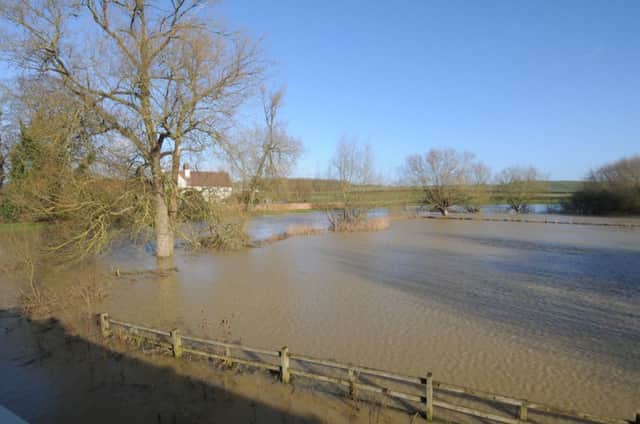 The River Leam has burst its banks. The scene from Marton bridge.