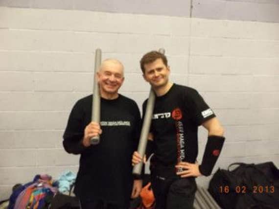 Viesturs Vavere and Lance Manely at a Krav Maga session at Trinity School.
