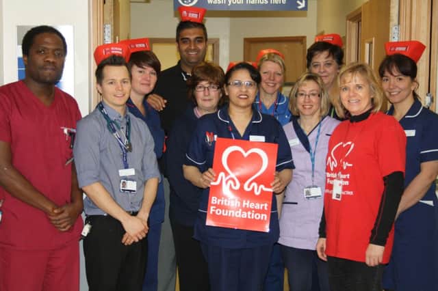 Balbinder Mattu (centre) and staff from Warwick Hospital's coronary care unit with Donna Stokes of the British Heart Foundation.