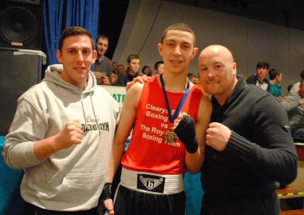 Coaches Jamie Bannister and Edwin Cleary with boxer Lewis Williams. 
Picture: Jo Symanowski