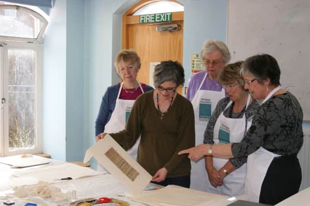 NADFAS volunteers Kate Spence, Margaret Higginbottom, Norma Hibben and Janet Warren with textile conservator Victoria Allan at the Pump Room gallery in Leamington.