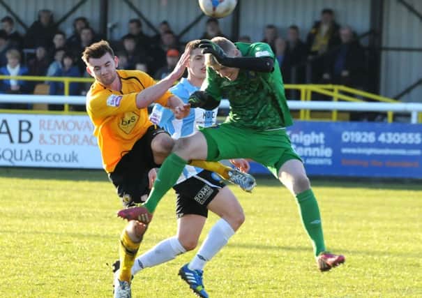 Danny Newton and Stockport keeper Ian Ormson clash while challenging for a cross. Picture: Morris Troughton  
MHLC-01-03-14 Brakes Stockport Mar05 NNL-140303-104412002