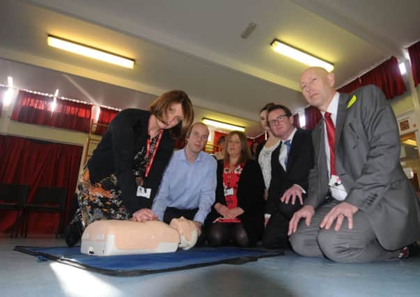Coton End school Co-Head Teacher Sarah Sheepy is taught CPR by Heart Start trainer Tim Morris, while looking on are her fellow C0-Head Hellen Dodsworth, Barford St Peter's school assistant Head Teacher Angela Johnson, Chris White M.P. and Ian Painter (Regional Development Manager for the British Heart Foundation). 
MHLC 27-02-14 Evelyn Feb43 NNL-140227-113754001