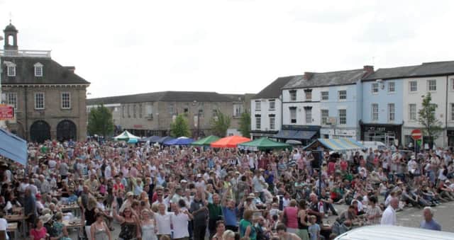 A large crowd gathers for a free concert in Market Place, Warwick, at the annual Warwick Folk Festival 2008.
Picture Submitted.
