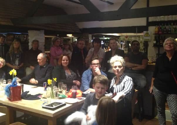 Tom Barnwell (centre, wearing glasses) with family and friends at the Newbold Comyn Arms where he watched himself on The Voice last Saturday.
