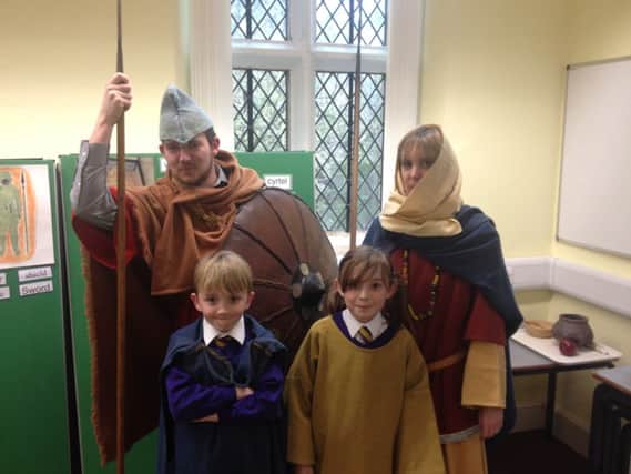 St Margaret's Primary School teachers with pupils Oscar Twomey, nine, and Niamh Mcdonnell, eight, as Anglo Saxons for the day.