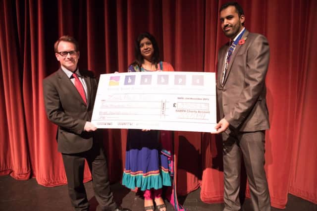 BABPA chairman Bhopinder Singh Sanghera presenting a cheque with Chris White MP to Muna Chauhan of Zoes Place last year.
