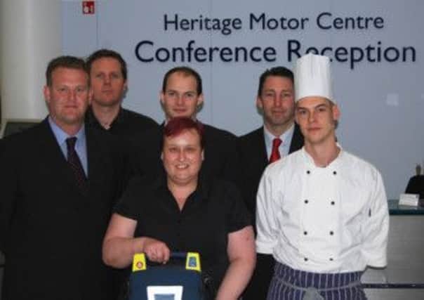 Staff at the Heritage Motor Centre with their new defibrillator.