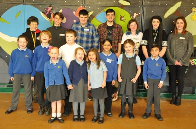 Pupils at Kingsway Primary School with members of Warwickshire College's Prince's Trust team who created the mural.