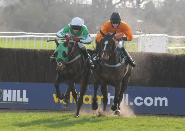 Handsome Buddy and Peter Carberry (left) went on to get the better of long-time leader Get Ready To Go and Harry Challoner in the Fairport Trelawny Handicap Steeple Chase. Picture: Morris Troughton