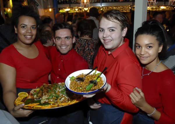 Staff show off the Caribbean food on offer at the opening of Turtle Bay in Regent Court, Leamington.