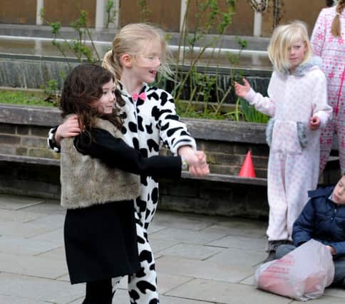 Young performers from Playbox Theatre showcasing street theatre as part of the Warwick Spring festival.