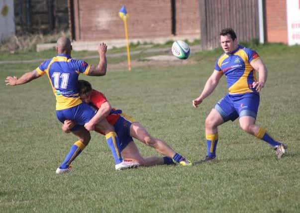 Dan Roberts looks to pick up the loose ball after Nyle Becketts progress is halted. Picture submitted