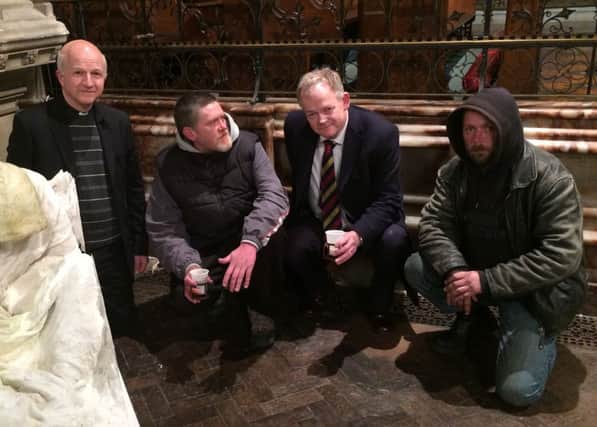 Prof Aidan Halligan with the Rev Christopher Wilson of All Saints church and two Leamington homeless men.