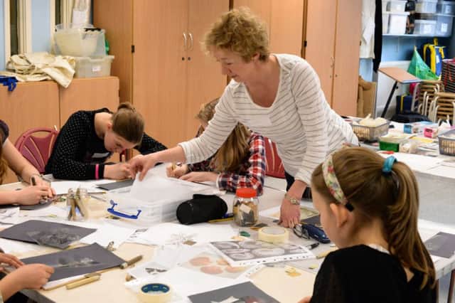 Artist Susie Turner shows children the art of printmaking at Leamington Art Gallery.